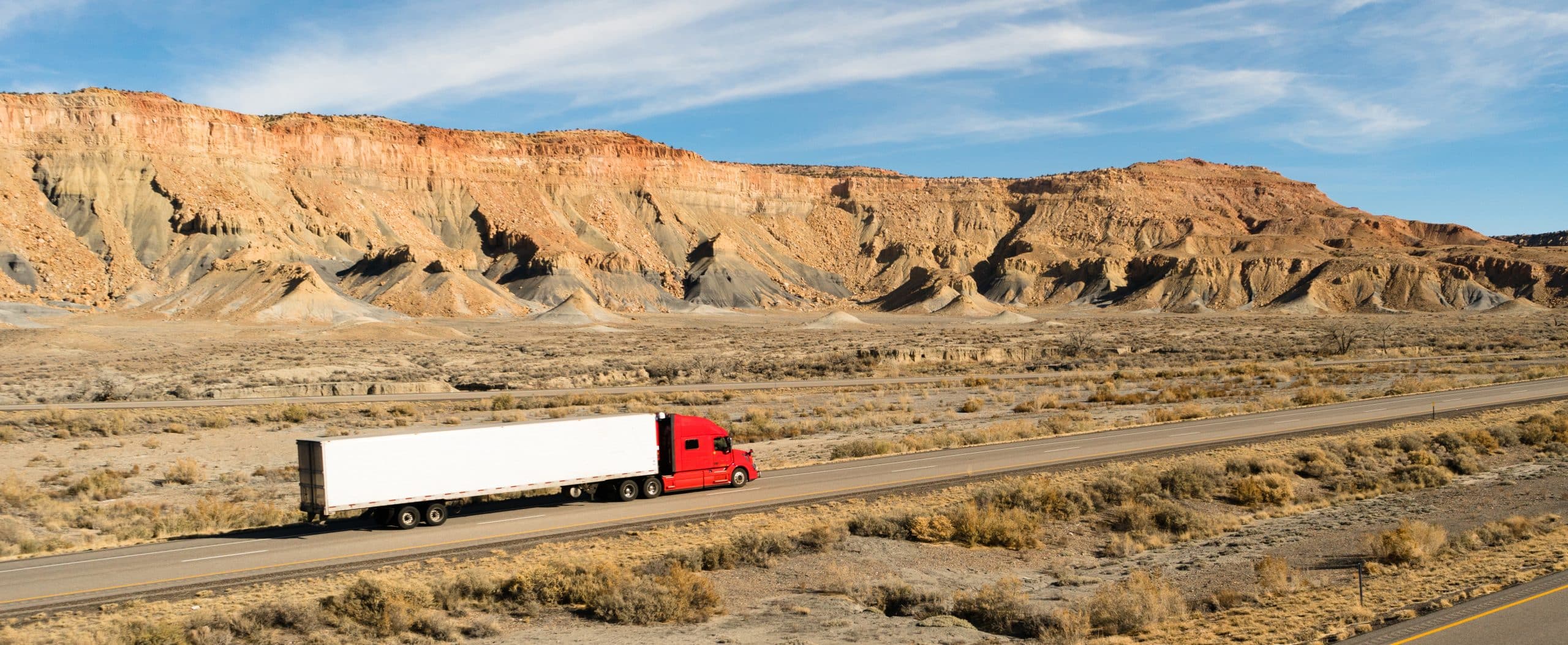 A trucker navigates this Utah highway in his big rig successful automatic truck wash Lazrtek 